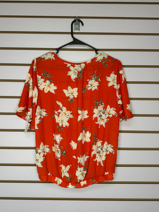 Blusa Naranja con Flores Blancas